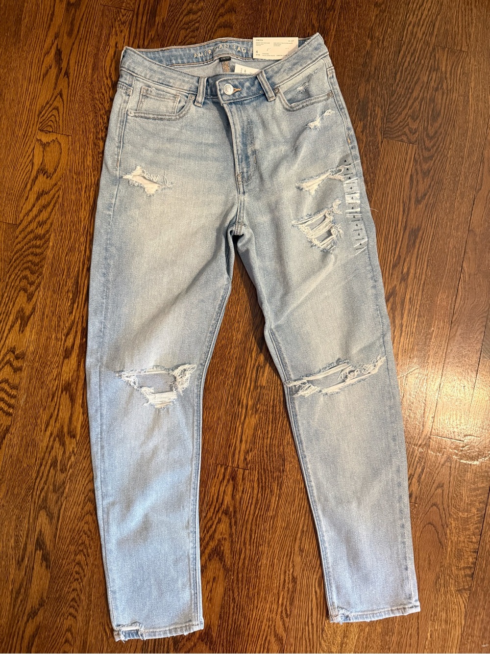 Light Blue Distressed Women’s Jeans highest rise mom Jean, Criss Cross size 4